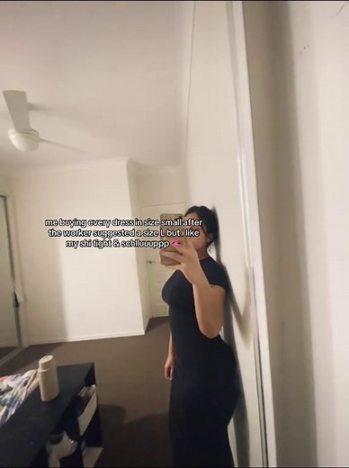 Stylish Black Dress Selfie in a Cozy Bedroom