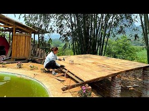 MAI finished installing the floor of the sturdy wooden gazebo by the pond.