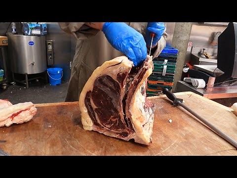London Butcher in a Street Food Market. A Look Into a Butcher's Shop Of English Beef from Yorkshire