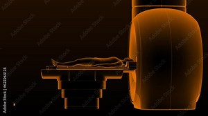 The patient moves in the MRI scanner and an MRI of the brain appears on the screen on a dark background