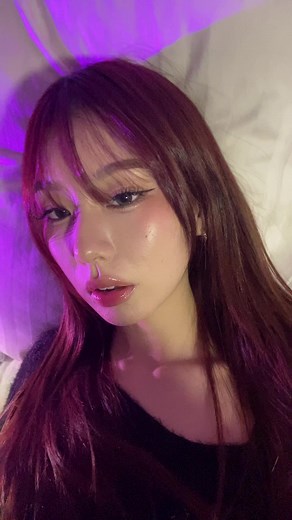 Relaxing with Dim Purple Lighting and Long Red Hair