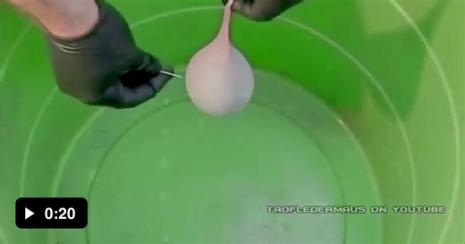What popping a balloon full of mercury looks like in slow motion - Video