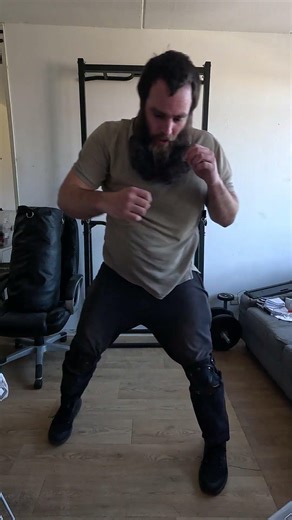 MMA (Mixed Martial Arts) training Get up from on one knee and then a hook punch