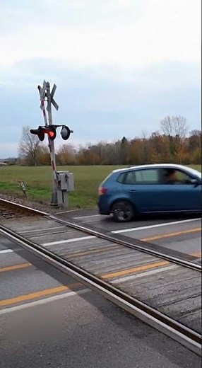 The car stalled on the tracks, luckily escaping collision with the train.