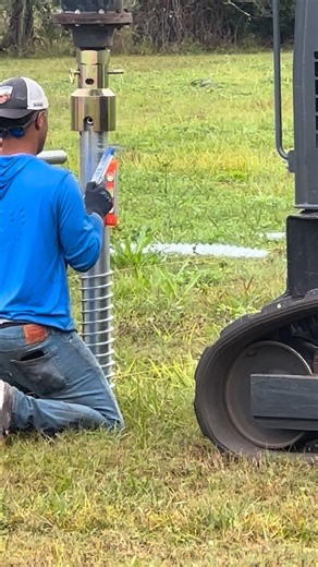 We are installing a ground-mount racking system to support 36 Hyundai 435 watt bifacial PV solar panels with Enphase IQ8HC invertors and an IQ5C combiner. Our customer has a large piece of land with a family home, a separate guest house, and a swimming pool. This system is designed to power all 3. First step: While Brad and Skylar dug a 190-foot-long, 18-inch-deep trench to route the electrical conduit from the panels to the combiner box, Devyn and David used the skid steer with an auger attachm