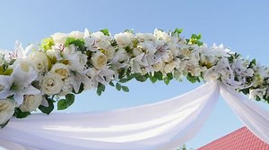clip-33473239-flowers-wedding-ceremony-arch-background
