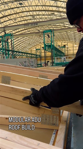 S2A Modular | The Future of Housing on Instagram: "Join marketing as we take you behind the scenes of our production line, highlighting how S2A Modular roofs are built for strength, efficiency, and longevity. ✨ By constructing our roofs indoors, we eliminate weather delays, improve precision, and deliver a higher-quality finished product - faster. It’s just one of the many ways we’re redefining modern modular construction. #S2AModular #ModularConstruction #BehindTheBuild #QualityFromTheTop #ADUC