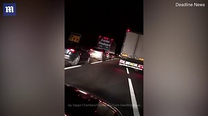 A rapper films a lorry driver straddling two lanes while driving