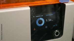 Close-up of a modern 3D printer display screen. Display screen of the 3d printer equipment shows the remaining production time. 3D printer display screen indicates the amount of layers made.