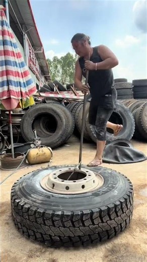 Hard‑Working Female Technician Struggles To Pry Heavy Truck Tire!