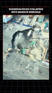 #FirstpostNews: Shanghai Road Collapses Into Massive Sinkhole A large sinkhole opened up in Shanghai’s Minhang District, swallowing a section of roadway and damaging nearby structures. Visuals from the scene match the area’s road layout, buildings and surrounding trees seen in file and satellite imagery, though the exact date of the footage could not be independently verified. Local authorities cordoned off the site following reports of a water leak at a nearby construction project. Satellite im