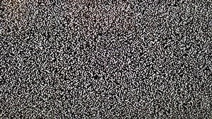 TV Static screen - black and white dotted old fashioned no signal error. Damage to the video signal with pixel noise.