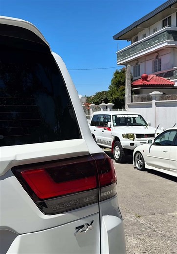 Twin White Cars: Double the Attitude