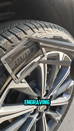 A handheld laser burns the rubber surface instantly, engraving tire specs with sharp, permanent marks. | Salud Studio