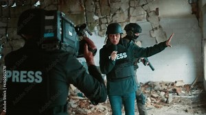 Female war journalist reporting live in the collapsed building, the site of the bombing in the war zone Stock Video