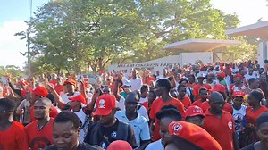 MCP youth escorting HE President Chakwera as he leaves the MCP Headquarters Gate after finishing his speech at their Get Together meeting today. | Master Chilunjika