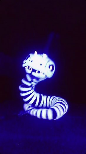Mesmerizing UV Snake Puppet Performance