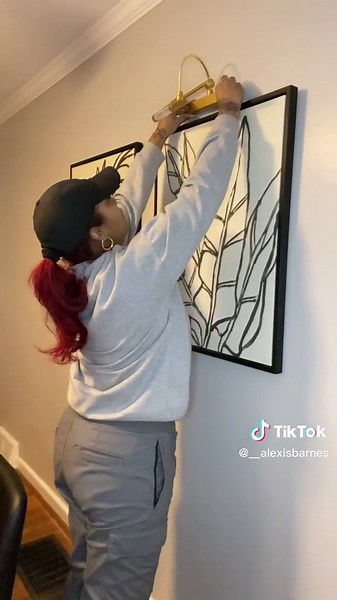 Hang picture lights using command strips I used the ones that can hold up to 16 pounds . #commandstrips #picturelights #targetfinds🎯 #amazonhomefinds #amazonhomedecor #picturelighting #homedecorideas #picturelight #commandstrip #homeasthetic #neturalhomedecor #modernhomedecor