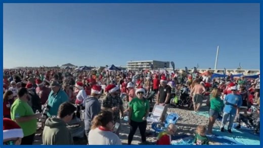 Florida surfers dressed as Santa, elves and reindeer catch waves for charity