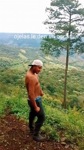 Muscular Man Dancing in Scenic Outdoor Landscape