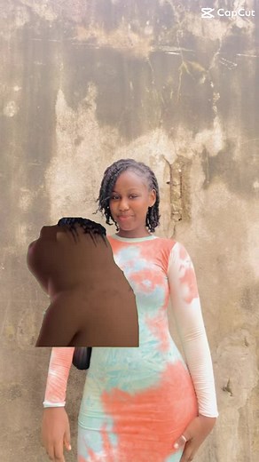 Stylish Tie-Dye Dress Showcase Against Weathered Wall