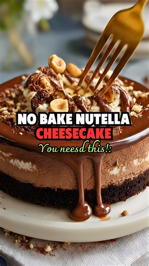 7 Ingredient No Bake Nutella Cheesecake 😋 With a 2-ingredient Oreo cookie crust and the creamiest Nutella cheesecake batter filling, you’ll love how easy and quick this Nutella cheesecake is to make (and no one will know it’s vegan!). Comment "Nutella cheesecake," and I'll DM you the recipe. #nutella #nutella🍫 #nutellacake #nutellacheesecake #NoBakeDessert #nobakedessert #nobakedesserts #nutellalovers #nutellalovers #nutellalover #decadentdessert #DecadentDesserts #decadentdesserts #asmrfood #