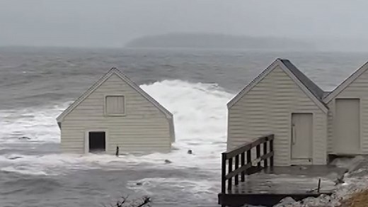 'She's gone!': Onlookers watch historic landmark get washed away by flooding