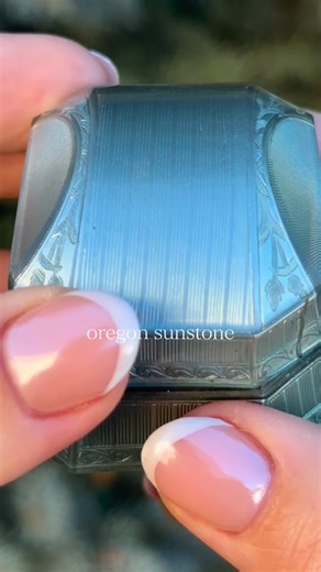 fire and embers trapped in stone ❤️‍🔥 oregon sunstone - the sister of moonstone and labradorite, mined ethically in the state of Oregon. these stones often contain “schiller” - tiny pieces of copper that shine as the stone shifts in the light. while most sunstones are champagne, orange, or reddish-orange in color, some sunstones can appear teal or green! #oregonsunstone #sunstonejewelry #uniqueengagementrings #alternativeengagementring | Staghead Designs