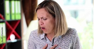 Beautiful sick woman is coughing at work. Colds bronchitis asthma and pneumonia concept