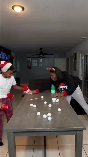 Blow the cotton ball Christmas Game. Blow the cotton off the cup, then who stack the cups first win!