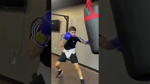 Ace Vega touching the heavy bag