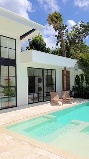 Get inspired by this stunning villa in bali, with its white terrazzo pool surrounded by natural stones and gorgeous color palette of white, teak wood, and black accents. 🌴🏡 Dreaming of building your own paradise? It’s more achievable than you think! With the right mindset, resources, and inspiration, your dream villa can become a reality. 💭✨ So let this beautiful villa be your motivation to take the first step towards making your dream a reality. Share with us in the comments below what’s on 
