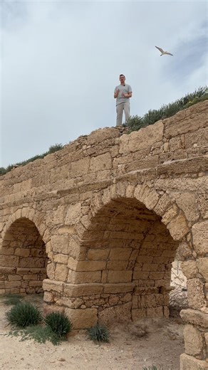 Standing on Herod the Great’s Aqueduct on Awueduct Beach in Caesarea, ISRAEL 🇮🇱🏝️🏛️