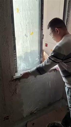 Installation of ceramic tiles below glass window frame #shorts