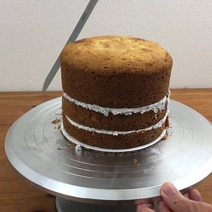 To sculpt a cake it's easiest if your layers are chilled so that they don't crumble as you carve them. I put mine in the freezer for about 30 minutes before starting. Go slowly – trim a little bit at a time until you're happy with the shape. Then if you chill the cake again before frosting it, crumbs are less likely to come off the cake and get into your frosting. This turned into an igloo cake and the tutorial is on my youtube channel: https://youtu.be/aGZyT2oDzCk | British Girl Bakes