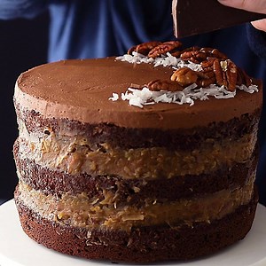 759K views · 349 reactions | New: German Chocolate Cake! Moist chocolate layered with a buttery brown sugar, coconut, and pecan filling. It's like a candy bar, in cake form! https://bakingamoment.com/german-chocolate-cake/ | Baking a Moment | Facebook