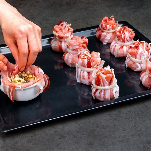 They disappeared first from the table! Pork meat bags, with a surprise Ingredients: pork meat - 1 kg (2.2 lb) bacon - 150 g (5.3 oz) for the saute: oil - 30 ml (1 fl oz) mushrooms - 250 g (8.8 oz) hard cheese - 180 g (6.35 oz) salt - 10 g (0.35 oz) black pepper - 4 g (0.14 oz) lemon - 40 g (1.4 oz) spicy red pepper - 25 g (0.9 oz) onion - 100 g (3.5 oz) IN THE OVEN 180 °C (356 °F)/35 MIN Tray size 25 X 30 cm (10 x 12 in) | Cookrate