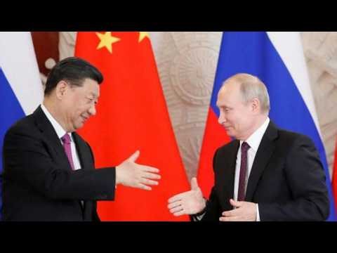 Putin visits China as Russia seeks deeper energy and trade ties