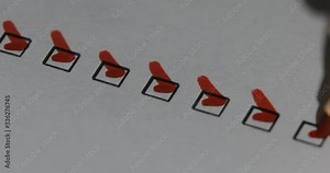 A person checking off a to do list with red pen. Check all the boxes of a checklist, close-up, 4k Person Ticks Checkbox Marks with a Pen, filling up To Do List.