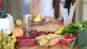 Woman squeezing half a lemon on a squeezer