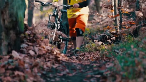 Guys Do Tricks With Snow Bikes