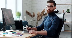Professional Creative Photographer using Digital Retouching Program, working concentrated in Loft Studio. Stylish Retoucher working at Home on Freelance. Future Professions.