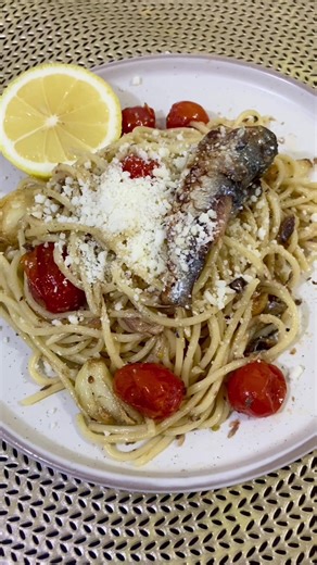 •\t1 can Spanish sardines (usually in olive oil or tomato sauce) \t•\t200–250 g pasta (spaghetti or any pasta you like) \t•\t3–4 cloves garlic \t•\t1–2 tbsp olive oil \t•\tCherry tomatoes (optional but adds freshness) \t•\tChili flakes (optional if you want it spicy) \t•\tSalt and black pepper, to taste \t•\tGrated cheese (Parmesan or quick-melt, optional) #spanishsardines #cooking