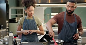 Kitchen, chef and cooking with teamwork in restaurant with cooperation for food, service or meal prep. Cooks, collaboration and start with spices, herbs and grill meat for catering luxury menu