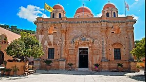 View of a monastery housing a museum of rare religious works in Crete. Byzantine architectural cruciform style with three domes Holy Trinity (Agia Triada) Tzagaroli Monastery in Greece.