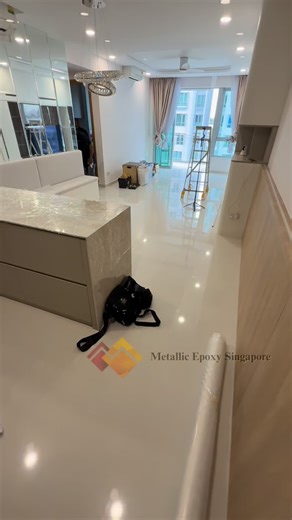 This condo living room was fully revamped using a Metallic Epoxy overlay system, no hacking, no dust, no mess. We worked directly over the existing tiled surface to create a seamless, grout-free floor with a soft cloudy base and elegant grey flow. Whether it’s old tiles, cement or marble — we overlay it all. Tailored designs, fast turnaround, and minimal disruption. Stay tuned for the final results after the protective top coat layer is applied. #MetallicEpoxy #NoHackingNeeded #SingaporeRenovati