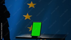 European Union counterintelligence division uses green screen tablet to protect against propaganda affecting elections. EU security service safeguarding democracy online using mockup device, camera A