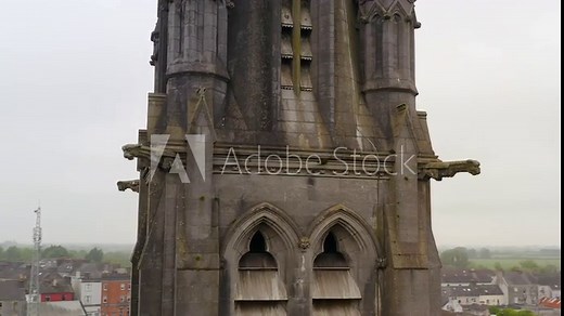 Saint Michael's Church in Ballinasloe Galway, aerial pan and orbit around mid section with stone statues