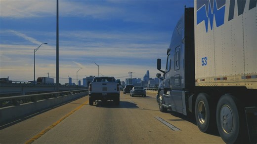 Traveling slow down a highway in a city - Free Stock Video