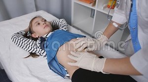 Woman Doctor Palpated the Belly of a Little Girl Patient in a Medical Office, Close-up. Stock Footage - Video of medical, clinic: 138669388